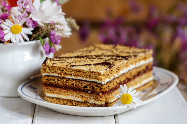 Homemade honey layer cake on the table. Party dessert - Photo, Image