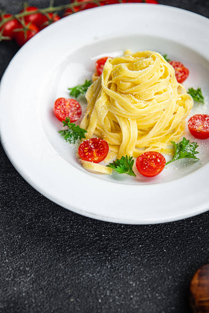 pasta tomato tagliatelle and parmesan cheese meal food snack on the table copy space food background rustic top view - Photo, Image