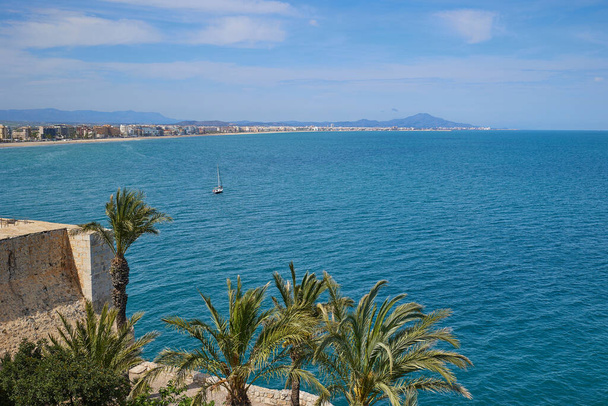 Spain. Valencia, Peniscola. View of the beach from a height of Peniscola Castle. Beautiful view of Mediterranean sea and small town on the cost. - Fotó, kép