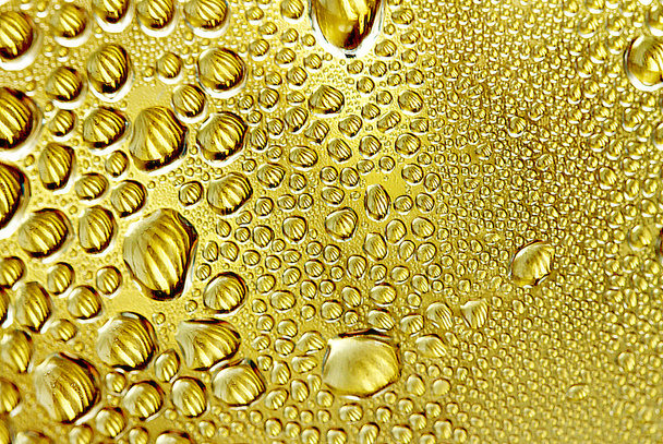 Drops on a golden background - Photo, Image