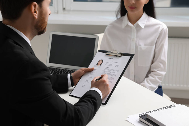 Human resources manager conducting job interview with applicant in office, closeup - Foto, Bild