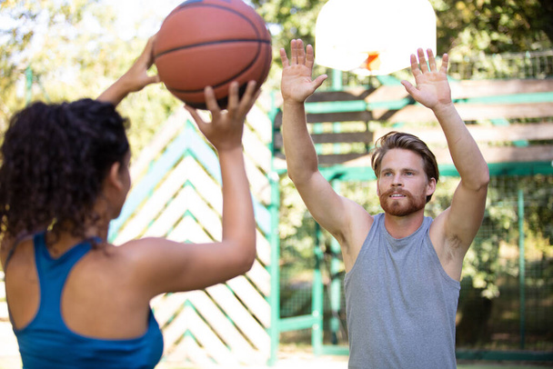 roup of happy people playing basketball outdoors - Photo, Image