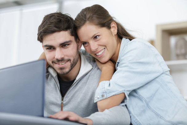 excited couple reading good news on laptop - Foto, immagini