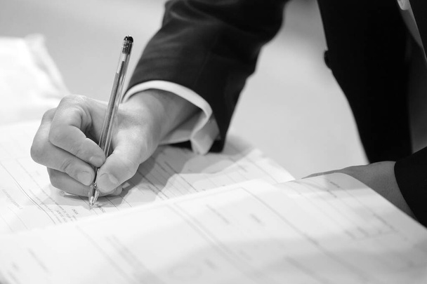 Groom signing marriage license or wedding contract - Фото, изображение
