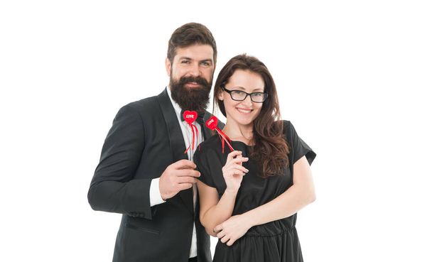 Family couple. Bearded man in tuxedo hug elegant woman. Proposal and engagement. Married couple hold red hearts. Happy relationship concept. Trustful relations. Happy valentines day. Couple in love. - Zdjęcie, obraz