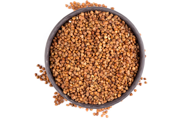 Buckwheat groats in a bowl, close up photo - 写真・画像