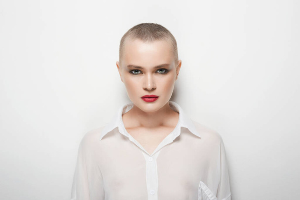 pretty young woman with short haircut. portrait of beautiful bald woman - 写真・画像