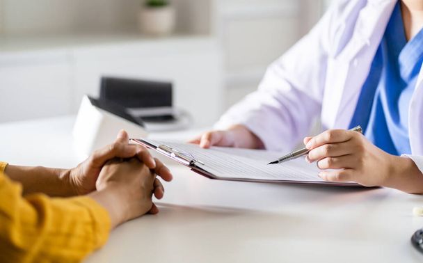 Healthcare. Doctor and patient are discussing interview consulting patient. Professional medical doctor in the hospital. Healthcare and medical  - Photo, Image