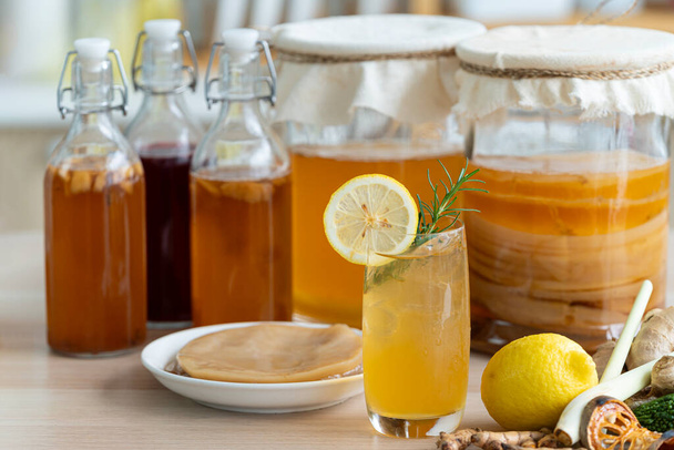 Kombucha superfood probiotic beverage in glass. Natural kombucha fermented tea beverage healthy organic drink in glass. - Foto, imagen