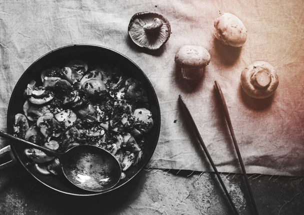 Sauteed mushroom in a pan ready to serve - 写真・画像