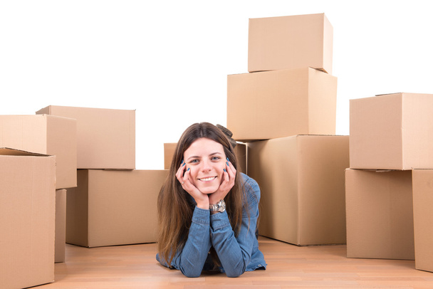 Girl with cardboard boxes unpacking - Zdjęcie, obraz