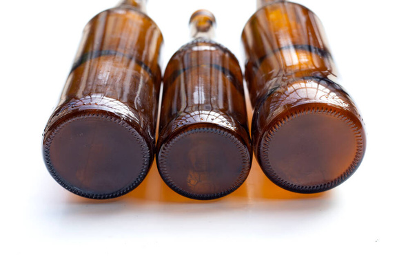Empty brown bottles on white background. - Фото, зображення