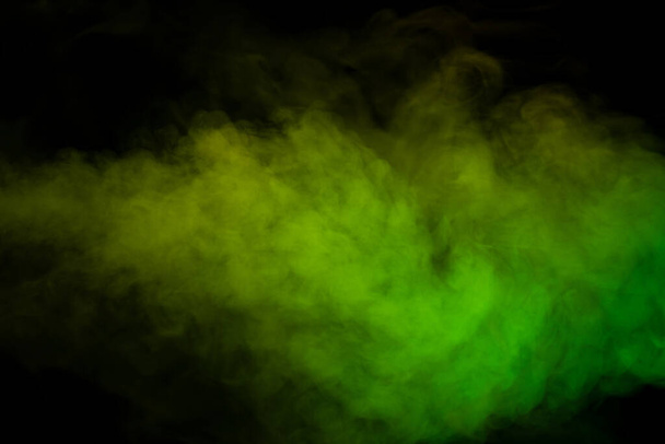 Yellow and green steam on a black background. Copy space. - Фото, зображення