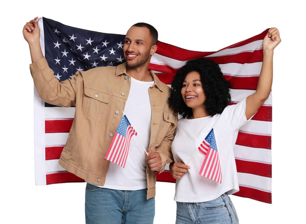 4th of July - Independence day of America. Happy couple with national flags of United States on white background - Foto, immagini