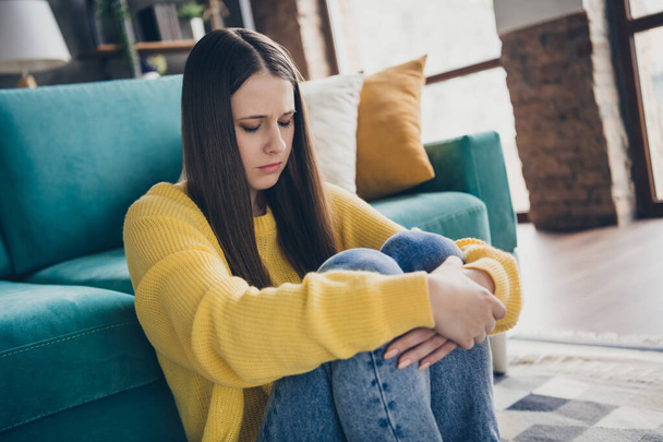 Portrait of pretty disappointed unsatisfied young lady sit floor arms hold legs crying mental problems house indoors. - Photo, image