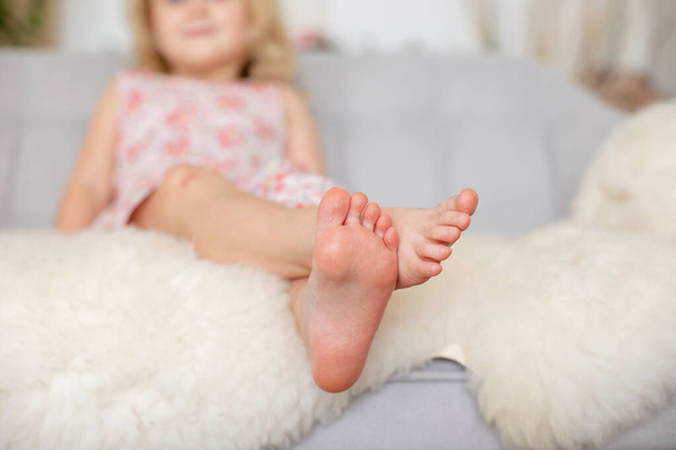Cute sweet toddler children, tickling feet on the bed, laughing and smiling, childish mischief, happiness - Foto, Bild