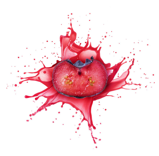 Half of a cut blueberry with a splashes of juice isolated on a white background - Fotó, kép