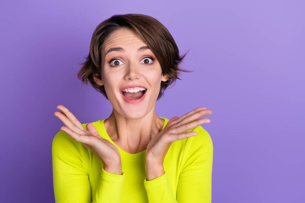 Photo of cheerful astonished person open mouth raise opened arms palms cant believe isolated on violet color background. - Photo, image