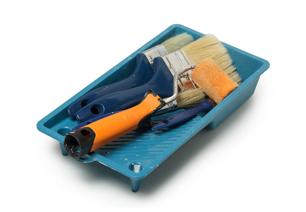 tray with used paint brushes and rollers isolated - Foto, immagini
