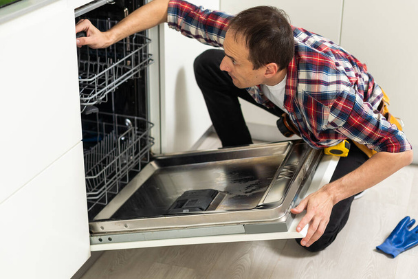 Dishwasher Repairing. High quality photo - Fotografie, Obrázek