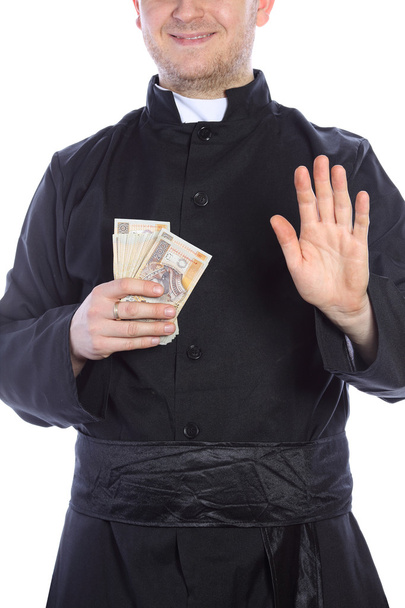 The young priest holding a lot of money in hand - Foto, immagini