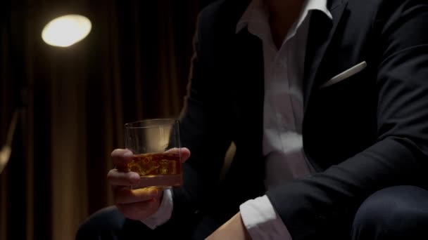 businessman holding whiskey, a restaurant - Footage, Video