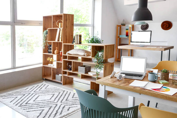 Graphic designer's workplace with laptop in interior of office - Photo, Image