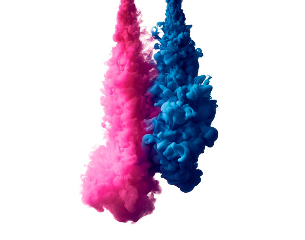 Fénykép a fröccsenő kék és rózsaszín festék vízben fehér háttér - Fotó, kép