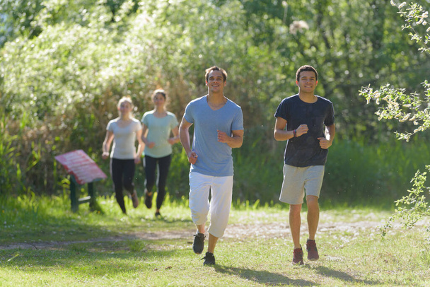 the joggers are running together - Valokuva, kuva