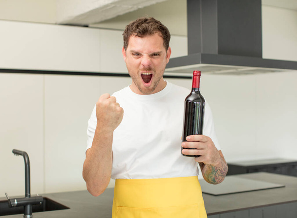 looking angry, annoyed and frustrated. bottle of wine concept - Photo, image