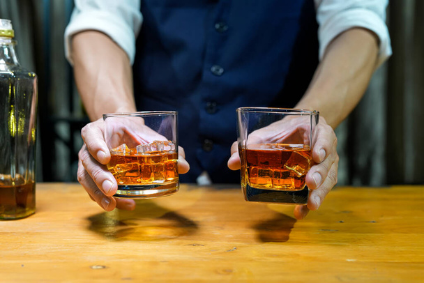 Bartender Serve Whiskey, on wood bar,  - Фото, изображение