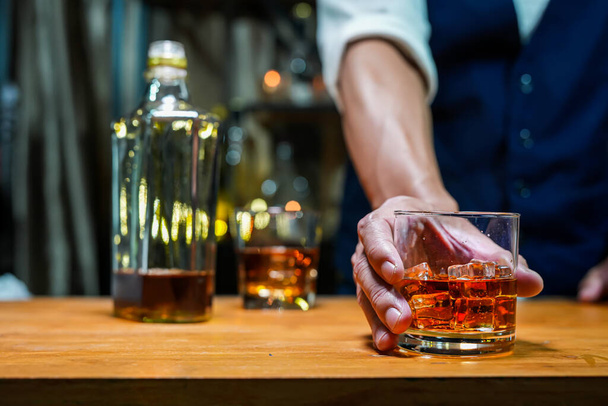 Bartender Serve Whiskey, on wood bar,  - Zdjęcie, obraz