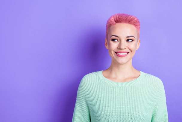 Portrait of positive cute person beaming smile look empty space wear green sweater isolated on purple color background. - Foto, Bild