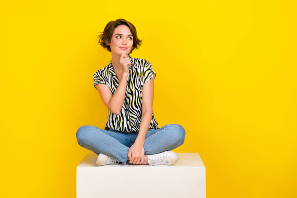 Full length photo of pretty dreamy lady wear animal print shirt arm chin looking empty space isolated yellow color background. - Valokuva, kuva