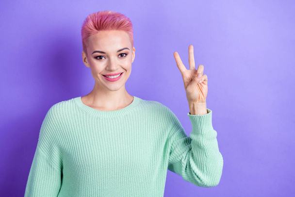 Portrait of cheerful lovely person tooth smile arm fingers show okey symbol wear teal sweater isolated on purple color background. - Foto, Bild