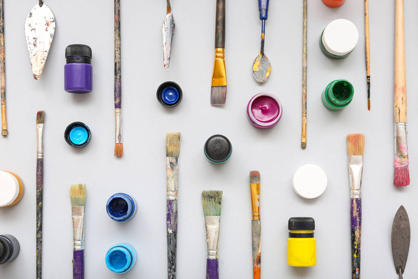 Composition with paint, brushes and painting knives on white background - Photo, Image