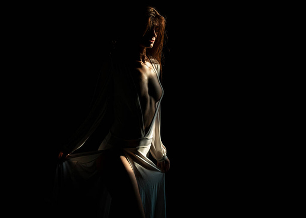 Sensual girl with sexy dress. Fashion model with beauty face. Tender woman on black dark background. Tenderness concept. Tenderness womans look. Concept of beauty and tenderness - Φωτογραφία, εικόνα