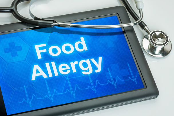 Comprimé avec le diagnostic d'allergie alimentaire sur l'écran
 - Photo, image