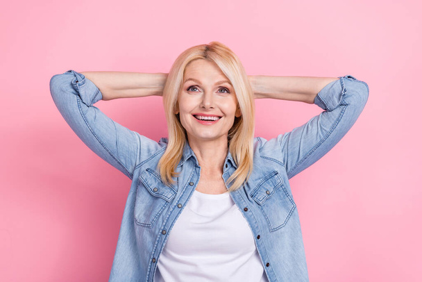 Photo of adorable senior lady hold arms behind head feel good look up resting vacation weekend isolated pink color background. - Φωτογραφία, εικόνα