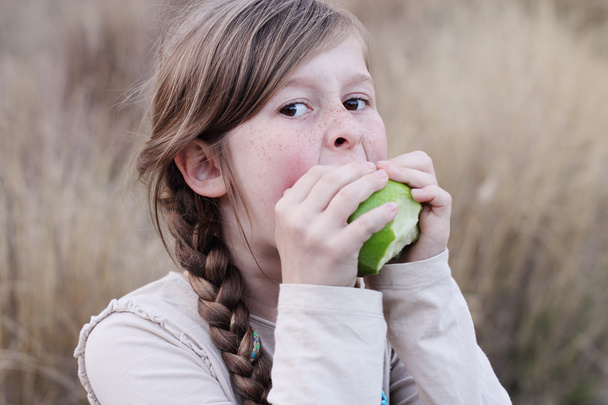 Girl eating green apple - Photo, image