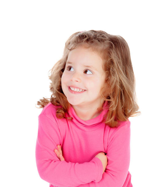 Маленькая девочка в розовом смотрит в сторону
 - Фото, изображение