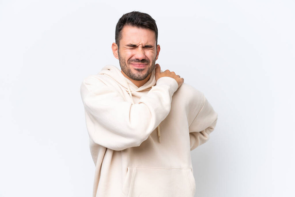 Young caucasian man isolated on white background suffering from pain in shoulder for having made an effort - Foto, Bild