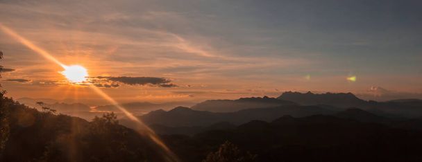 sunset over the mountains in  chiahg mai thailand - Foto, Imagen