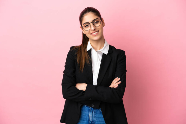 Young caucasian business woman isolated on pink background keeping the arms crossed in frontal position - Φωτογραφία, εικόνα