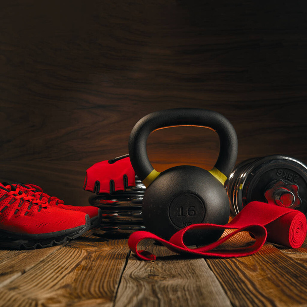 Black kettlebell close-up on a fitness equipment background. - Foto, afbeelding