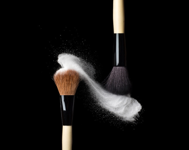 powderbrush on black background with blue powder splash - Zdjęcie, obraz