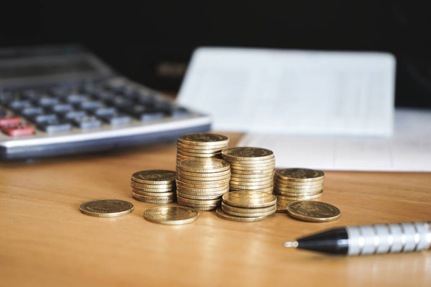 coin stack on calculator, business concept, saving  - Φωτογραφία, εικόνα