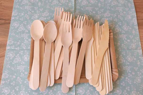 Picnic wooden cutlery and paper plates. Natural materials. Plastic free. - Fotó, kép