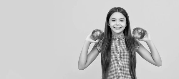 happy teen girl with red apple fruit. vitamin and dieting. Child girl portrait with apple, horizontal poster. Banner header with copy space - Fotó, kép