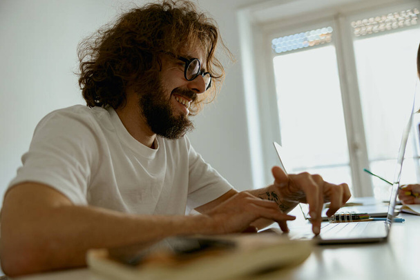 Entrepreneur businessman sitting at home and working on laptop online. Remote work concept - Foto, Imagem